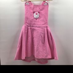 So Cuddly And Cute Care Bears Pinafore! Its Made From A Soft Beautiful Cord Material With Pockets, Adjustable Back Straps And Back Zipper And Of Course That Cute Care Bear Stare Perfect For Any True Care Bear. Collector Size 2x Pink Mini Dress For Spring Occasions, Cute Care Bears, Care Bear Stare, Care Bear, Care Bears, Dolls Kill, Back Strap, Pink Dress, Of Course