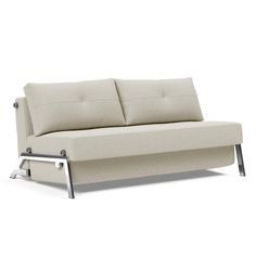 a white couch sitting on top of a metal frame