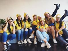 a group of young women sitting next to each other