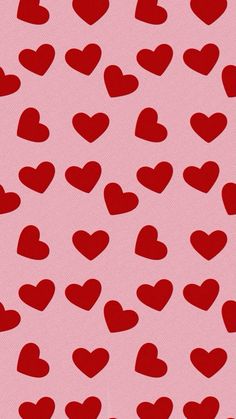 a pink background with red hearts on it