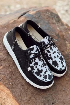 Black Western Shoes, Cow Print Hey Dude Shoes, Hey Dude Aesthetic, Cute Western Hey Dudes, Western Shoes Sneakers, Hey Dudes Cow Print, Black Hey Dudes Outfit Women, Hay Dude Shoes, Cow Hey Dudes