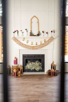 the fireplace is decorated with flowers and candles