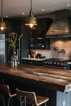 a kitchen island with stools next to it and an oven in the back ground