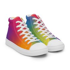 Elevate your style game with our vibrant Men's Rainbow High Top Canvas Sneakers! Handmade with love and bursting with trendiness, these shoes are the perfect way to add a splash of color to any outfit. Step into the fun and get yours now! * Crafted with 100% polyester canvas upper side for durability and style * Features an ethylene-vinyl acetate (EVA) rubber outsole for all-day comfort and support * Enjoy breathable lining and a soft insole for a cozy feel with every step * Showcasing a faux leather toe cap for added flair and durability * Stay comfy with a padded collar and secure fit with the lace-up front Get ready to turn heads and make a statement with these playful and stylish high top canvas sneakers! Men's High Top Sneakers, Rainbow High, Mens High Tops, Canvas Sneakers, Shoes Trainers, Custom Shoes, Mens Shoes Sneakers, High Top, Color Splash