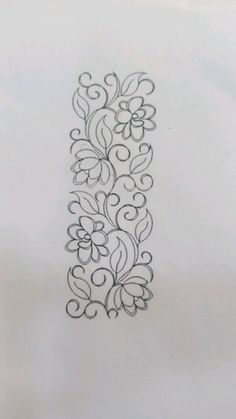 a black and white drawing of a decorative design on a piece of paper that has been drawn