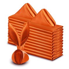 a stack of orange napkins sitting on top of each other