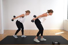 two women are doing exercises with dumbbells