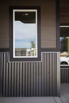 an open window on the side of a house