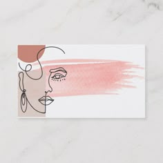 a business card with a woman's face painted in pink and orange on it