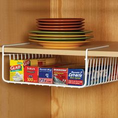 a shelf that has some plates and bowls on it