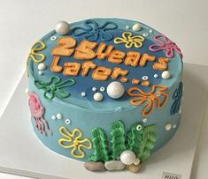 a birthday cake with under the sea theme on it's side and words underneath