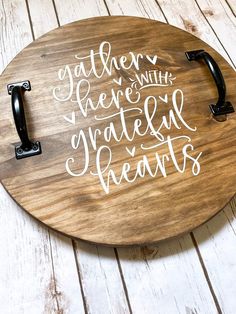 a wooden cutting board with some writing on it