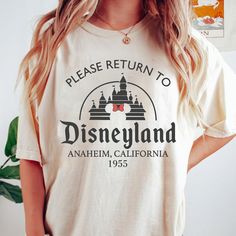 a woman wearing a disneyland california t - shirt