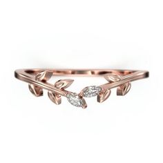 a rose gold ring with two leaves on the side and one diamond in the middle