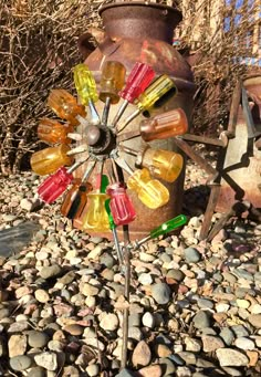 an old rusty fire hydrant with colorful glass bottles on it