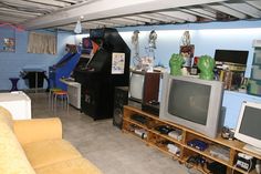 a living room filled with furniture and lots of clutter