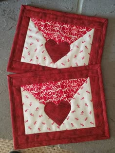 two red and white quilts with hearts on them