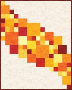 an orange and yellow quilt with squares on it