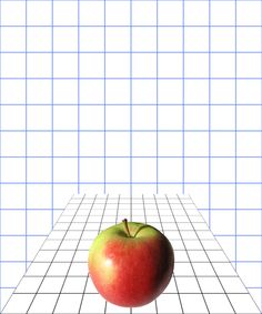 an apple sitting on top of a white tiled floor next to a blue grid wall