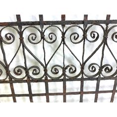 an old iron fence is shown against a white background