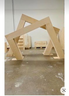 two wooden structures sitting in the middle of a room