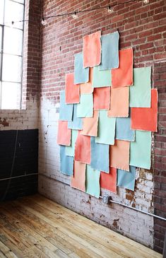 there is a large piece of paper on the wall next to a wooden floor in an empty room