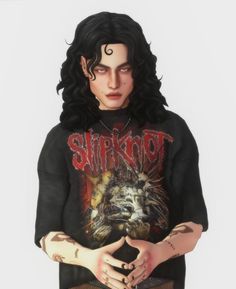 a man with long black hair and tattoos on his arm, wearing a shirt that says slipknot