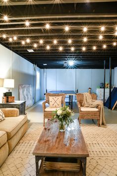 a living room filled with furniture and lights