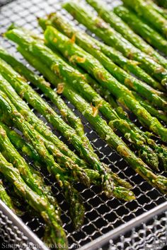 asparagus on a grill with water droplets