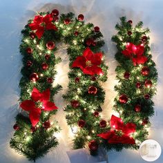 the letter u is made up of christmas decorations and lights, with poinsettis