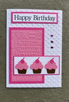 a birthday card with cupcakes on it and the words happy birthday written in pink