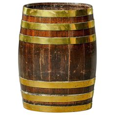 an old wooden barrel with gold stripes on the bottom is shown in front of a white background