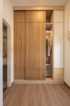 a closet with wooden slats and sliding doors