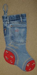 a pair of blue jeans with mickey mouse appliques on the bottom and inside