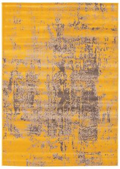 a yellow and gray rug with an abstract design on the bottom, in grey and yellow tones