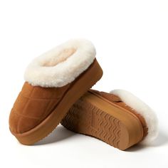 Trust us: they're as cozy as they look. With genuine shearling offering all over comfort and genuine suede providing proven indoor/outdoor durability, these clogs are a must for relaxing anytime, anywhere. Adorned with quilted details and a plush cuff, you're sure to stay cozy with these memory foam clogs. Winter Suede Clogs With Leather Footbed, Suede Slippers With Plush Lining And Round Toe, Winter Shearling Slip-on Mules, Brown Shearling Indoor Slippers, Winter Shearling Clogs With Cushioned Footbed, Winter Suede Clogs With Textured Footbed, Winter Sheepskin Slippers With Suede Lining, Winter Sheepskin Clogs With Suede Lining, Brown Shearling Slippers With Round Toe