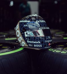 a helmet sits on top of some tires