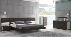 a modern bedroom with concrete walls and flooring