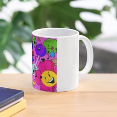 a white coffee mug sitting on top of a wooden table