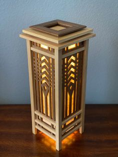 a small wooden lantern sitting on top of a table