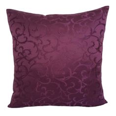 a purple velvet pillow with an intricate design on the front and back, sitting on a white background