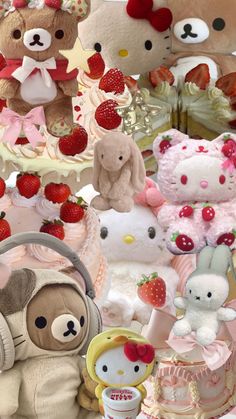 there are many stuffed animals and cakes on the table with strawberries in front of them