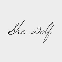 the word she wolf written in cursive handwriting on a white background with black ink