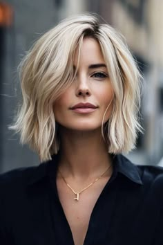 angled bob, mesmerizing hairstyles, elevated look Blond Angled Bob, Cropped Bob With Bangs, Modern Angled Bob, Side Swoop Bangs Short Hair, Blonde Bob With Roots, Bob With Long Bangs Angled, Asymmetrical Lob With Bangs, Short Blonde Bobs With Bangs, Side Part Bob Haircut