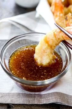 dipping sauce in a glass bowl with shrimp on the side