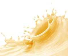 an orange liquid splashing on top of it's surface in front of a white background