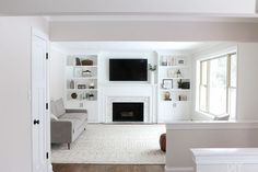 the living room is clean and ready to be used as a den or home office