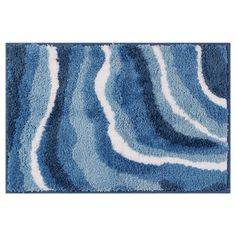 a blue and white rug with waves on it