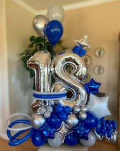 the number twenty two is surrounded by blue and silver balloons