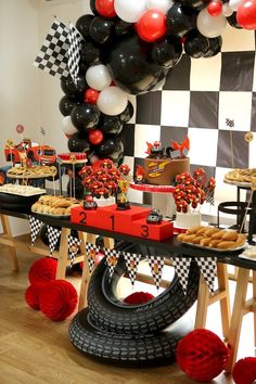 a race car themed birthday party with black, white and red balloons